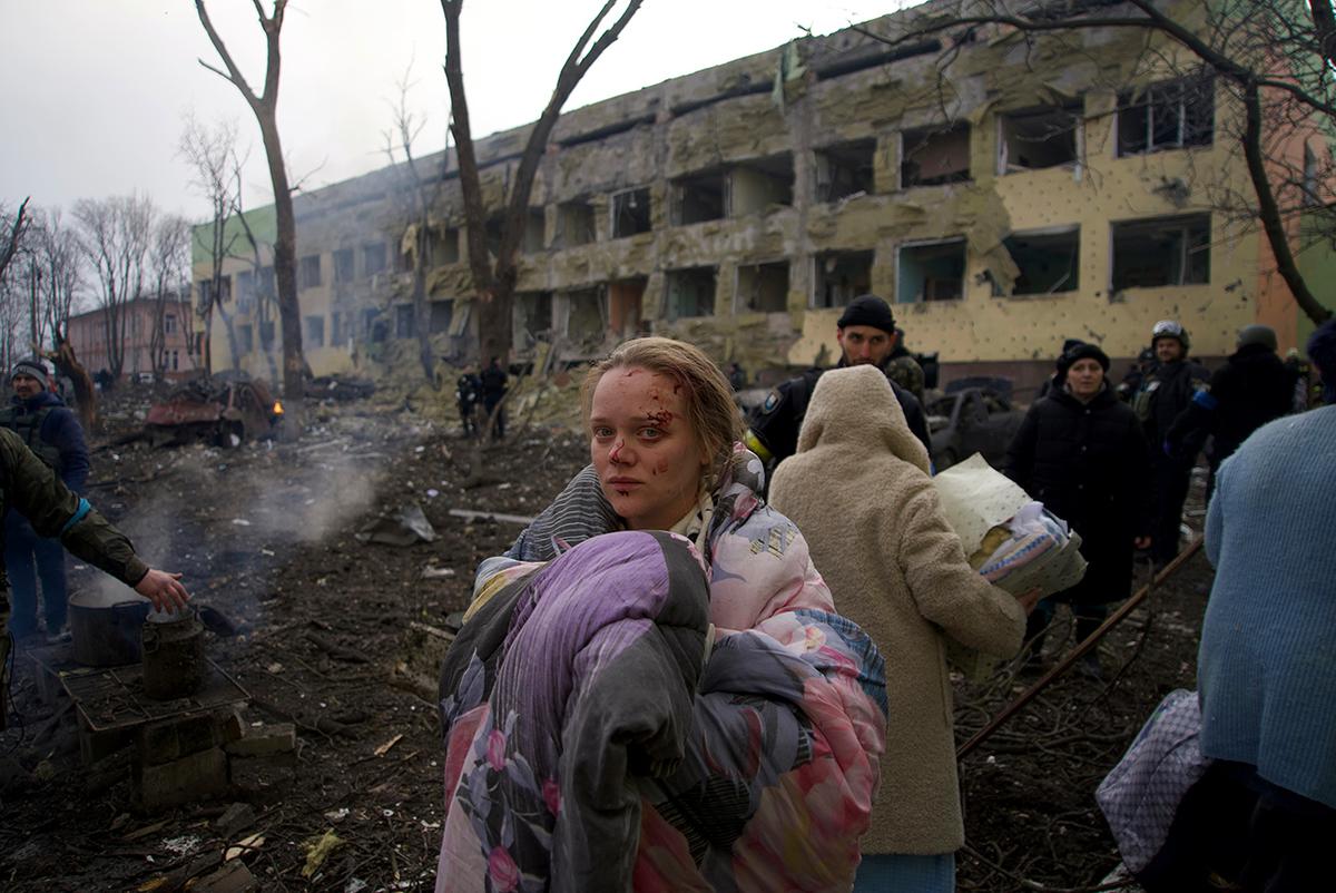 One of the women in labor, Marianna Vyshemirskaya, near the maternity hospital that was damaged by shelling in Mariupol on March 9, 2022