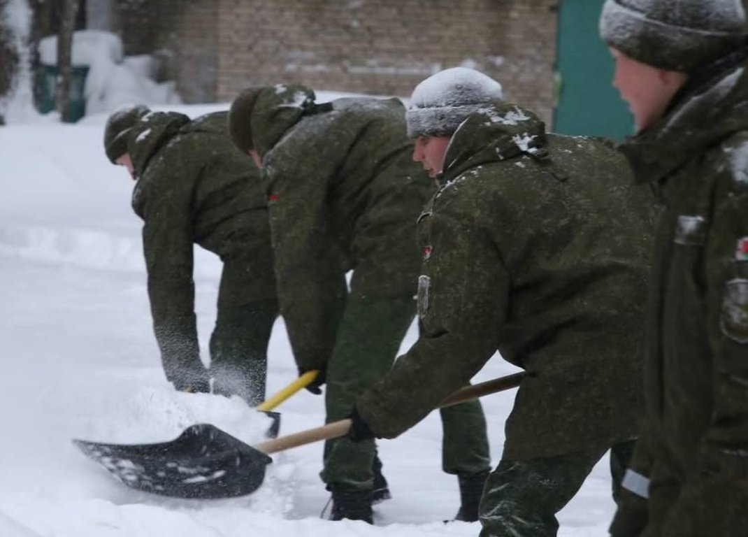 Belarusian military personnel removing snow after a heavy snowfall