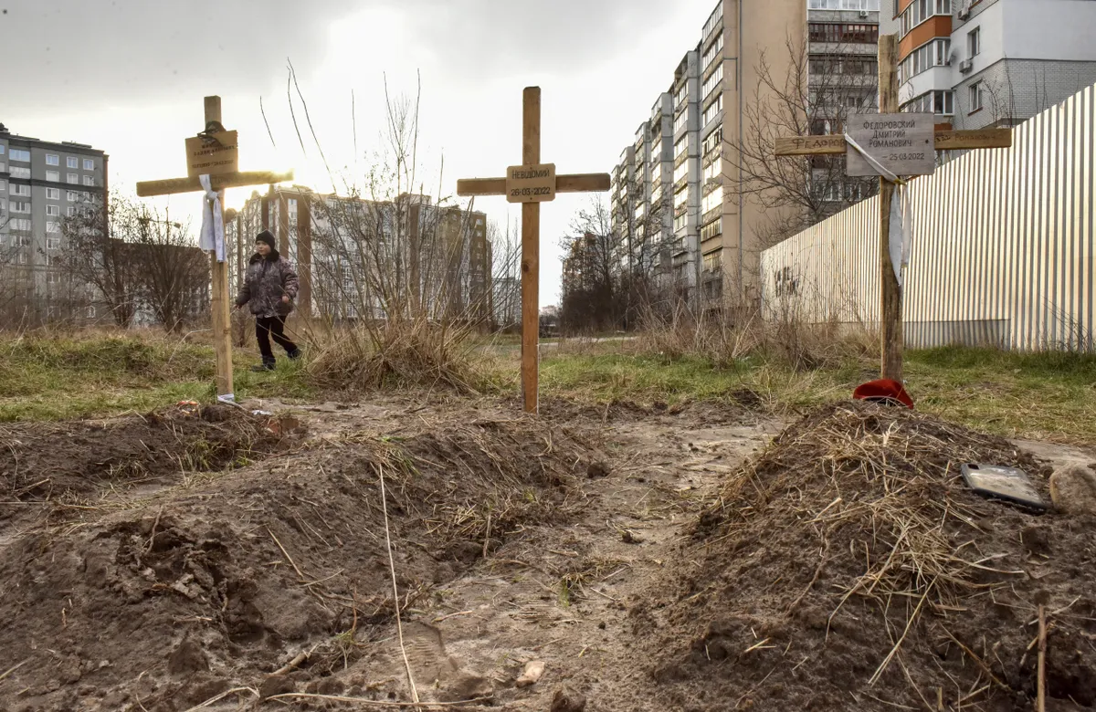 Graves in front of a residential building in Bucha, April 4, 2022.