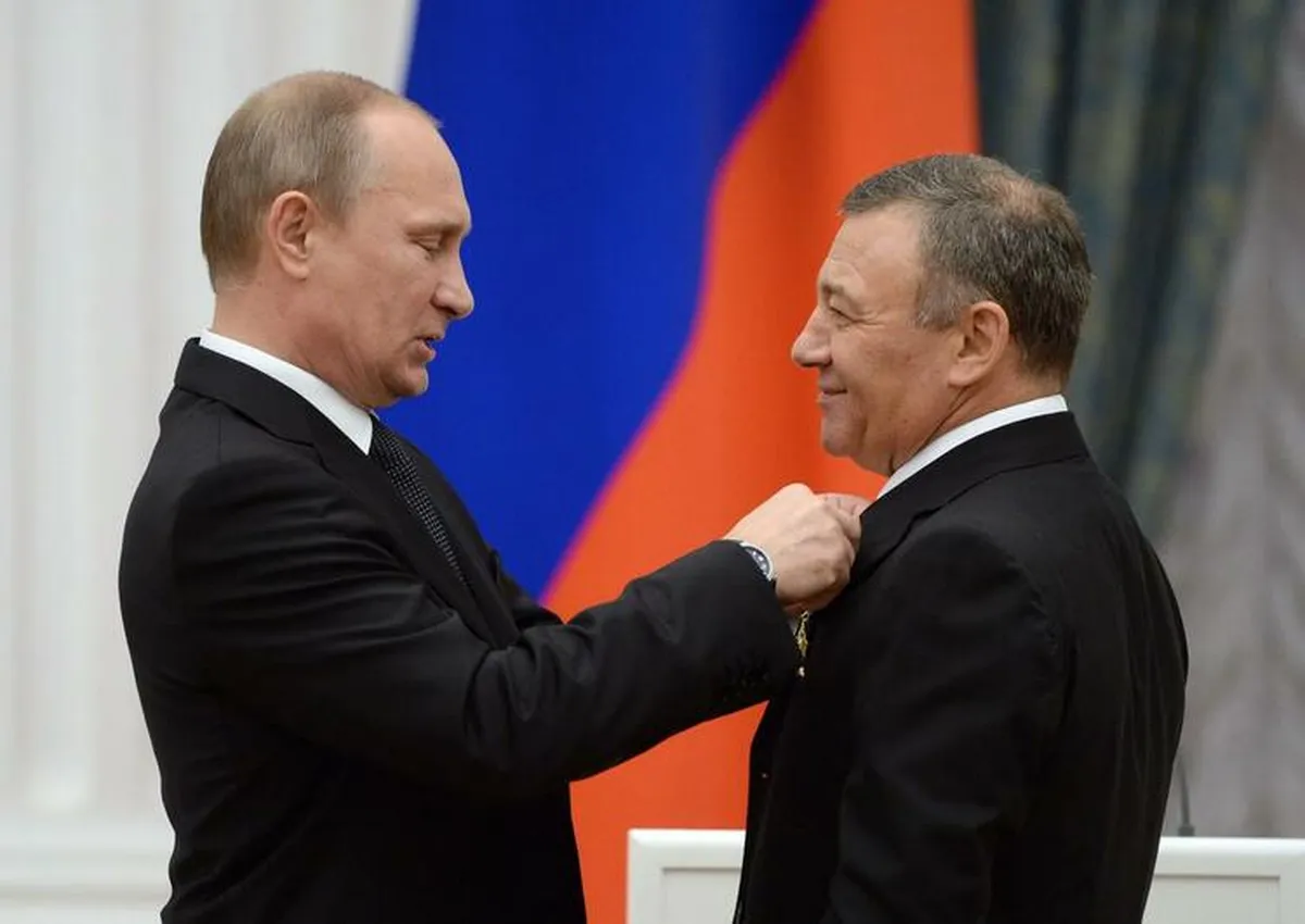 Vladimir Putin and Arkady Rotenberg at the presentation of state awards to outstanding citizens of Russia in 2013 