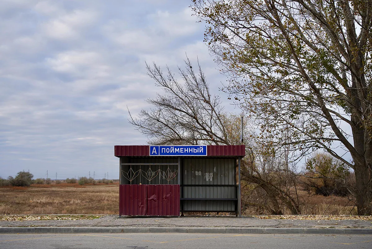 Bus stop on the highway, to which residents of Poymennoye walk three kilometers in order to catch a ride.
